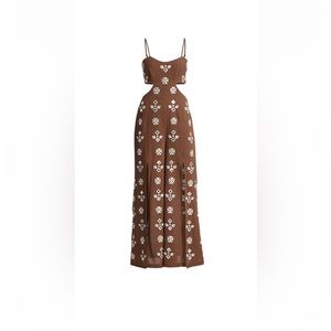 Crafted of woven cotton, Free People's Geo Daze jumpsuit. NWT $248.00.Size small